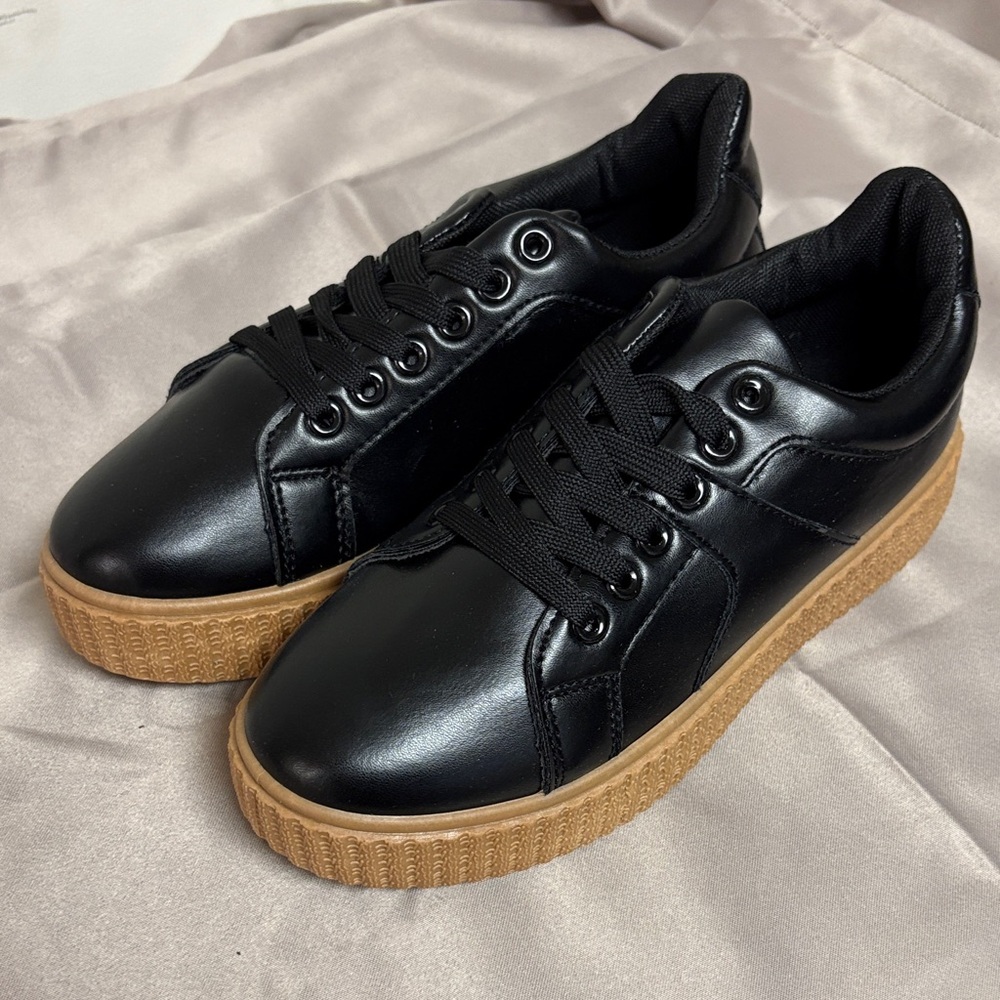 Sleek Black Sneakers with Tan Soles